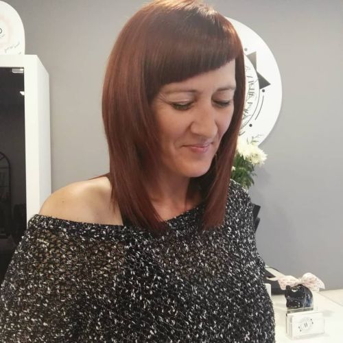 Melena midi flequillo asimétrico